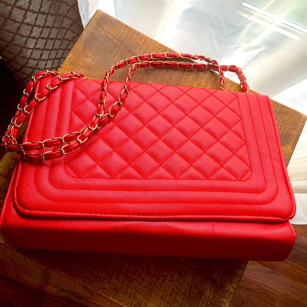Red quilted purse with gold braided strap